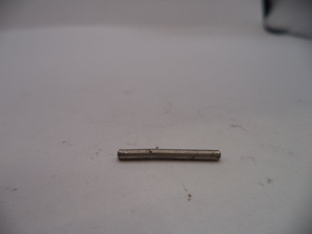 Small cylindrical metal object on a white surface