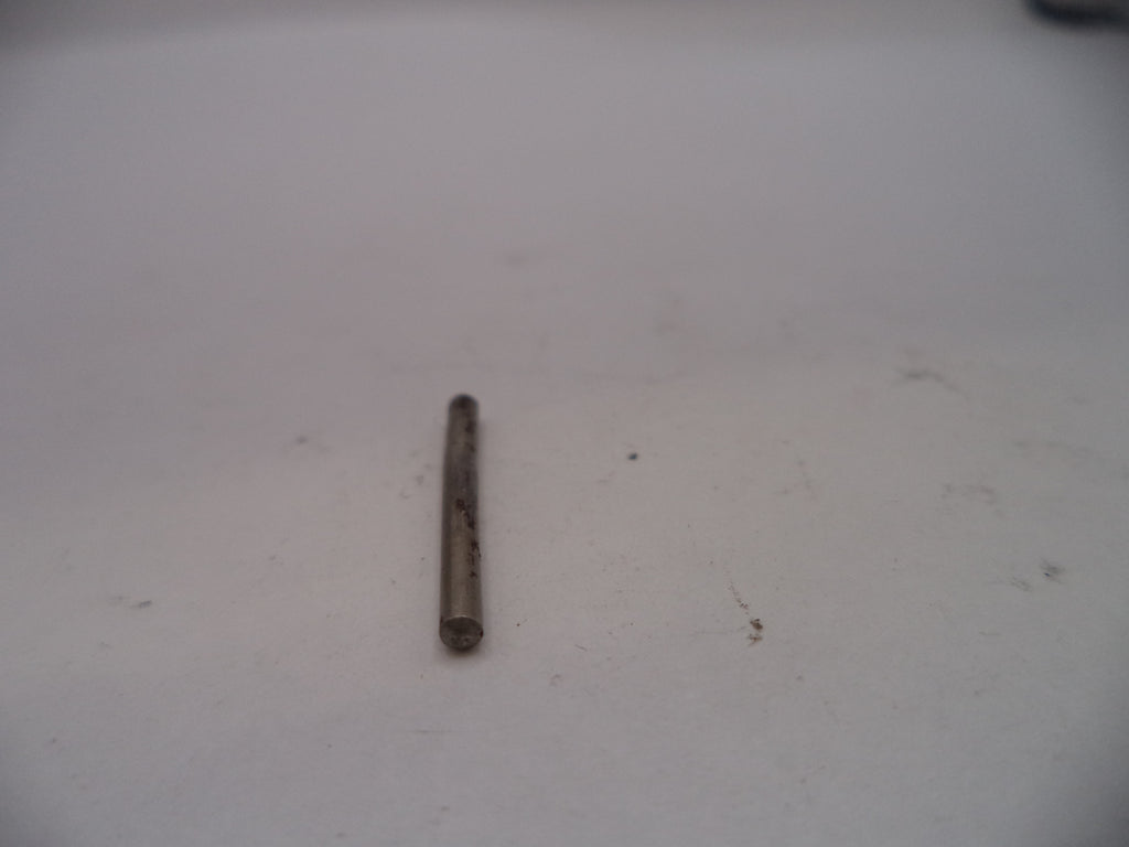 Small cylindrical object on a white surface