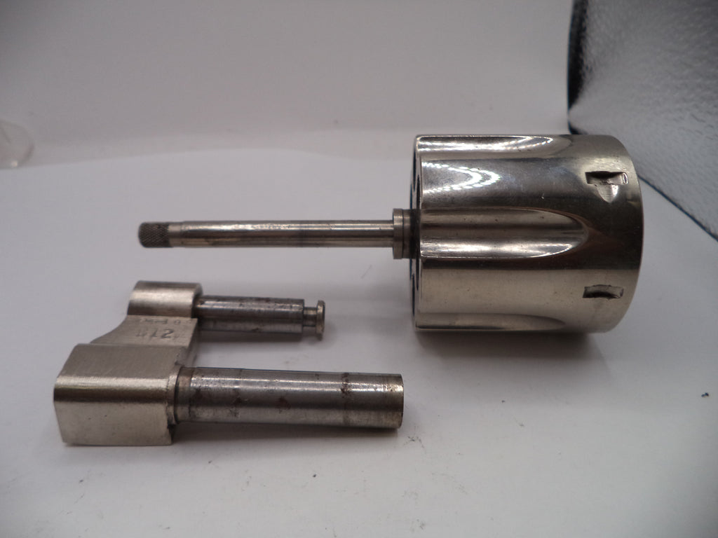 Two metallic cylindrical components on a white surface
