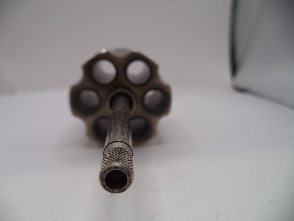 Close-up of a revolver barrel on a white background