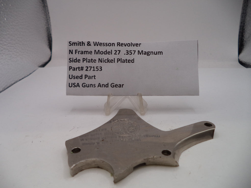 Smith & Wesson revolver side plate with a label on a white background