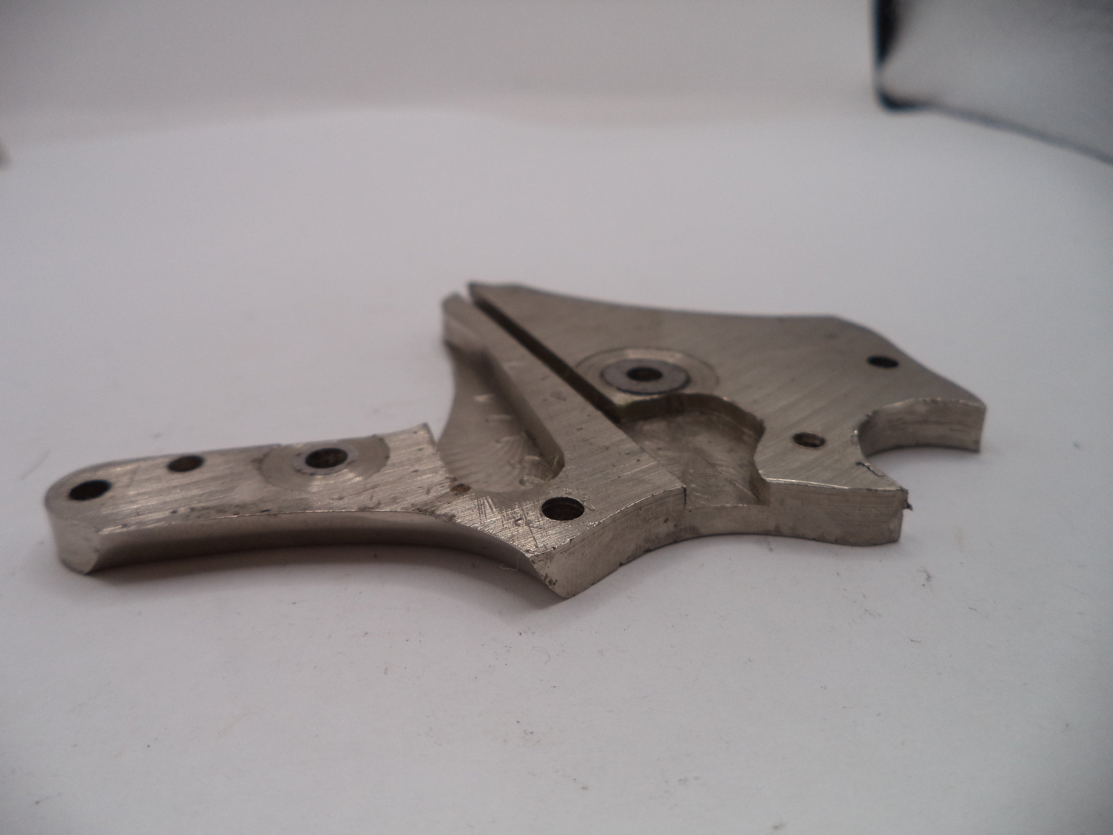 Metal mechanical component on a white surface