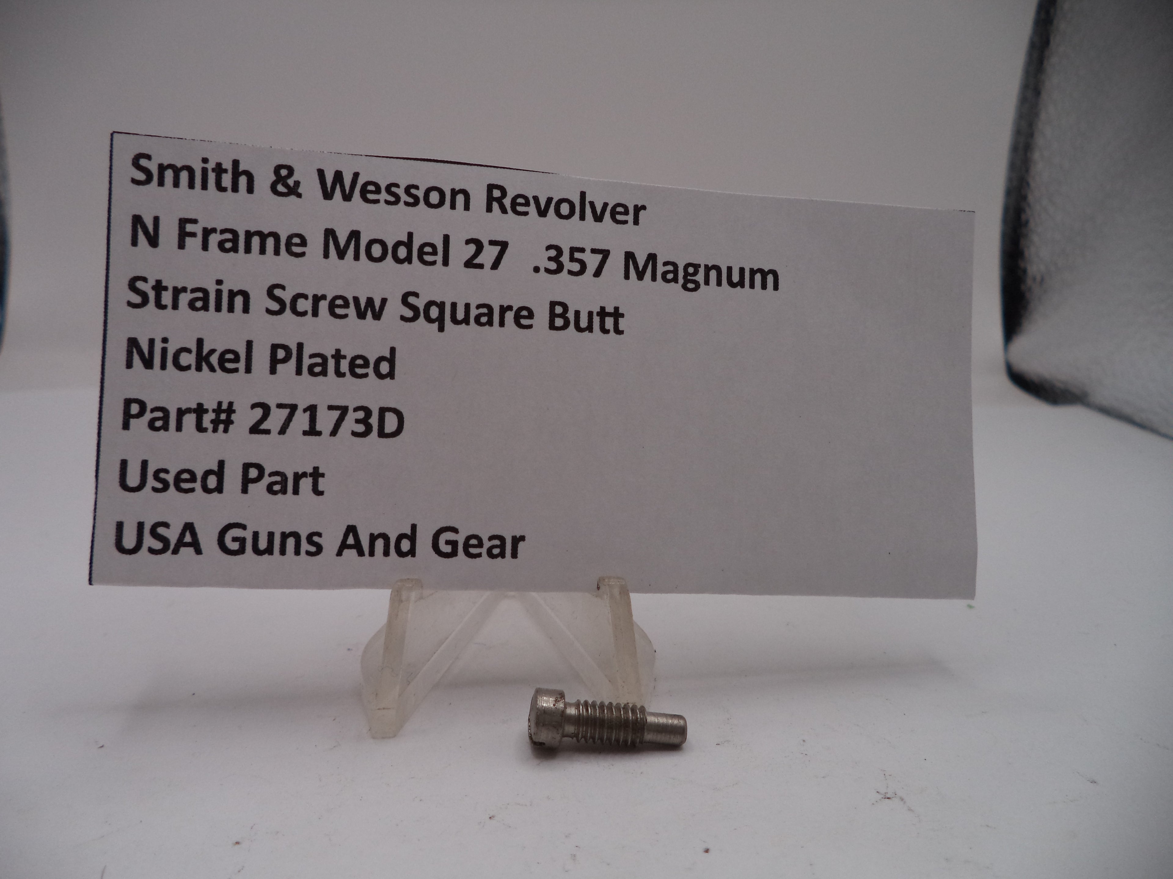 Strain screw with label detailing specifications on a white background