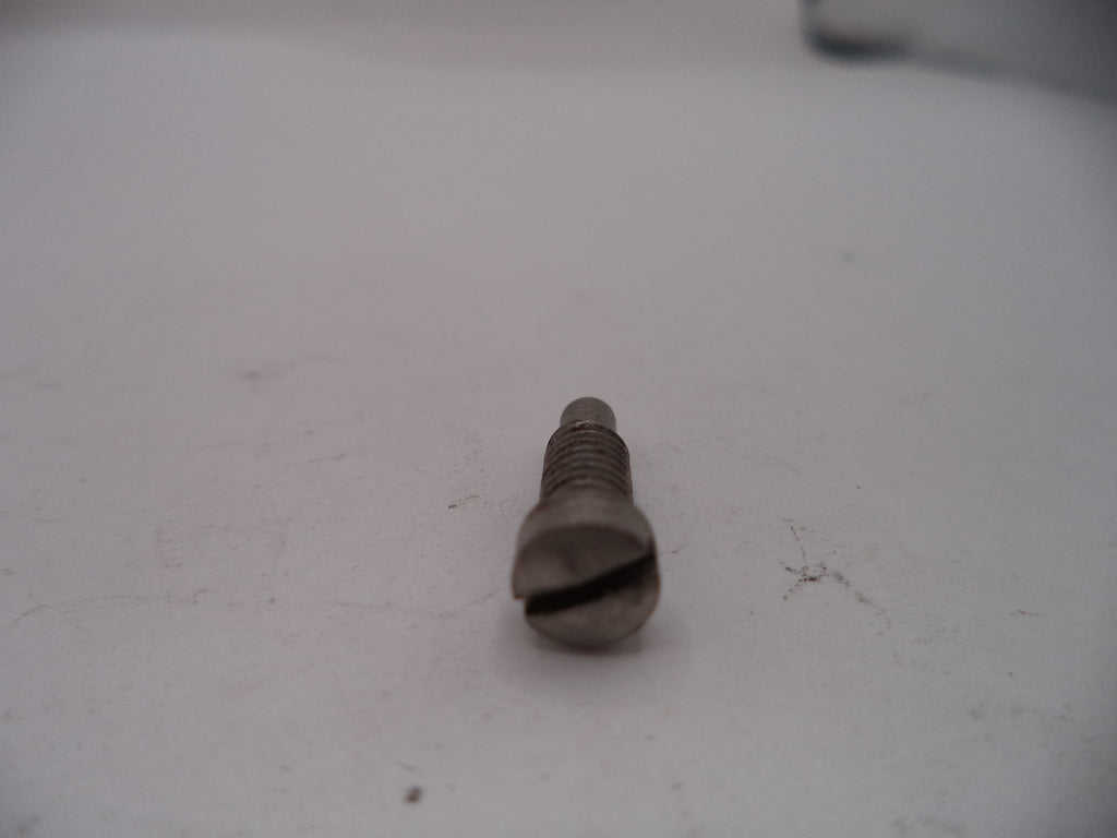 Metal screw on a white surface