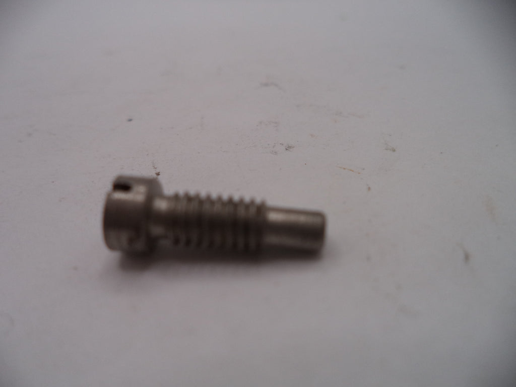 Metal screw on a light gray background