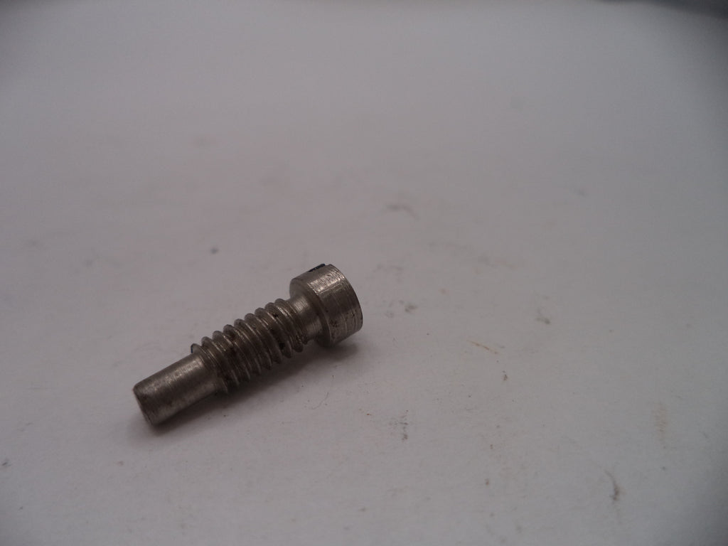 Metal screw on a white surface