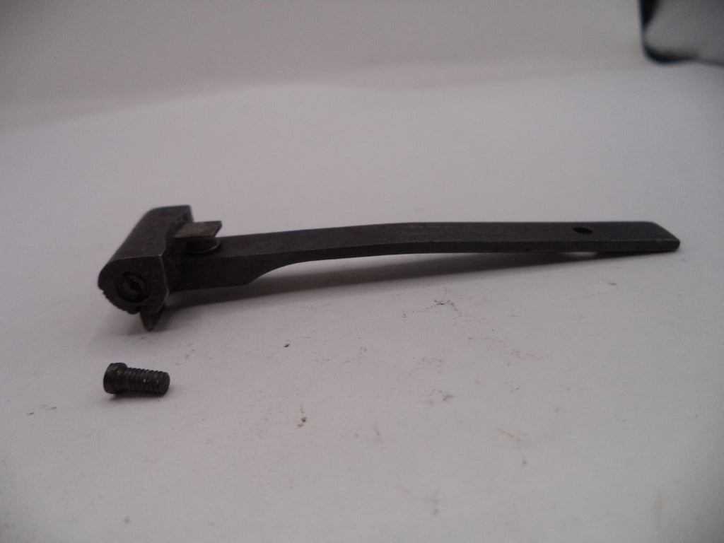 Black metal bracket and screw on a white surface