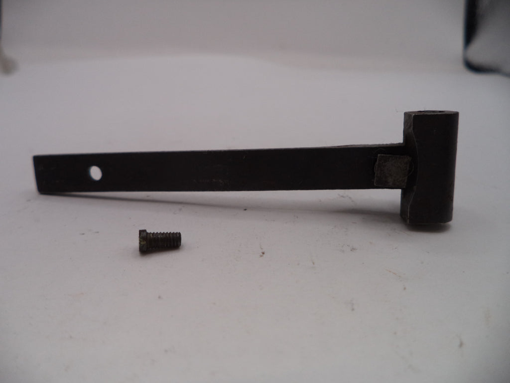 Black metal bar with a small screw on a white surface