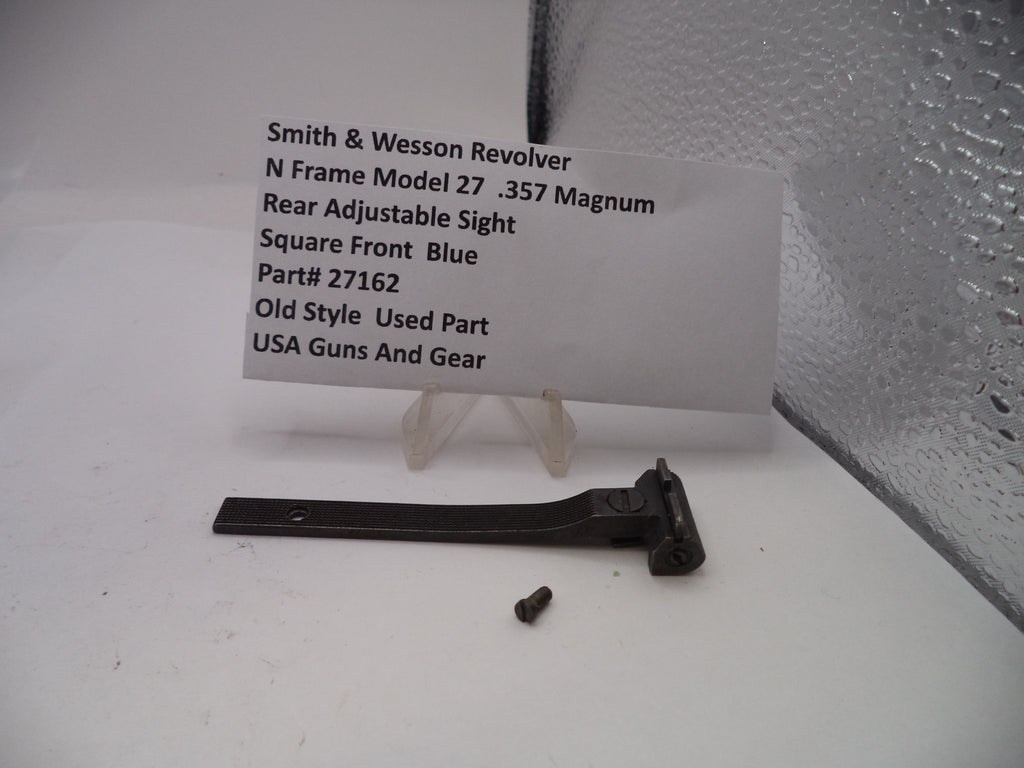 Smith & Wesson revolver sight with a label on a white surface
