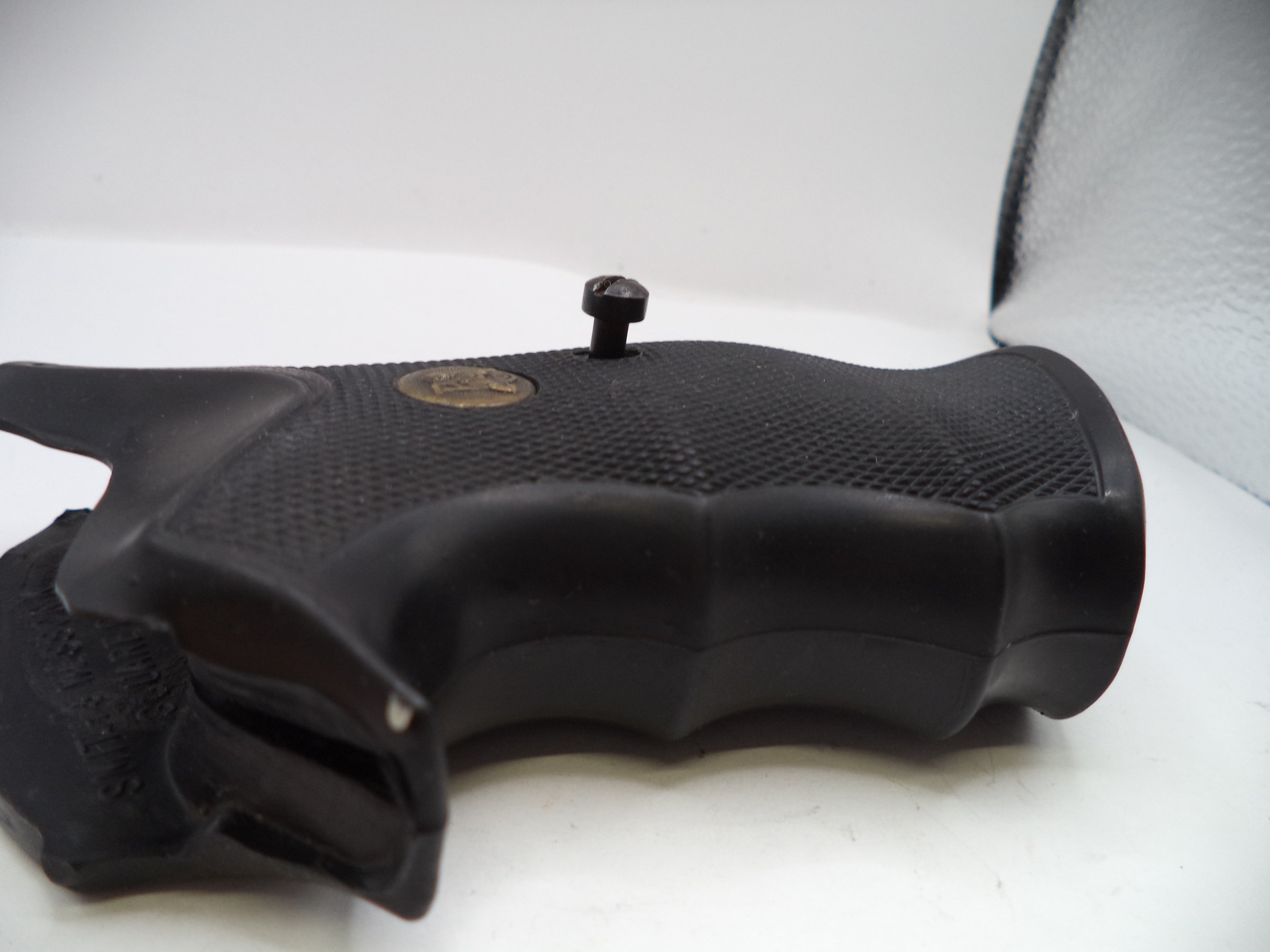 Black gun grip on a white background