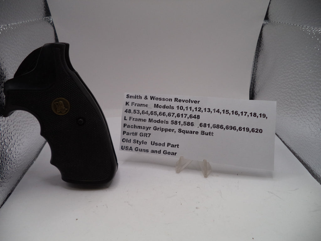 Smith & Wesson revolver with a card detailing model numbers on a white background