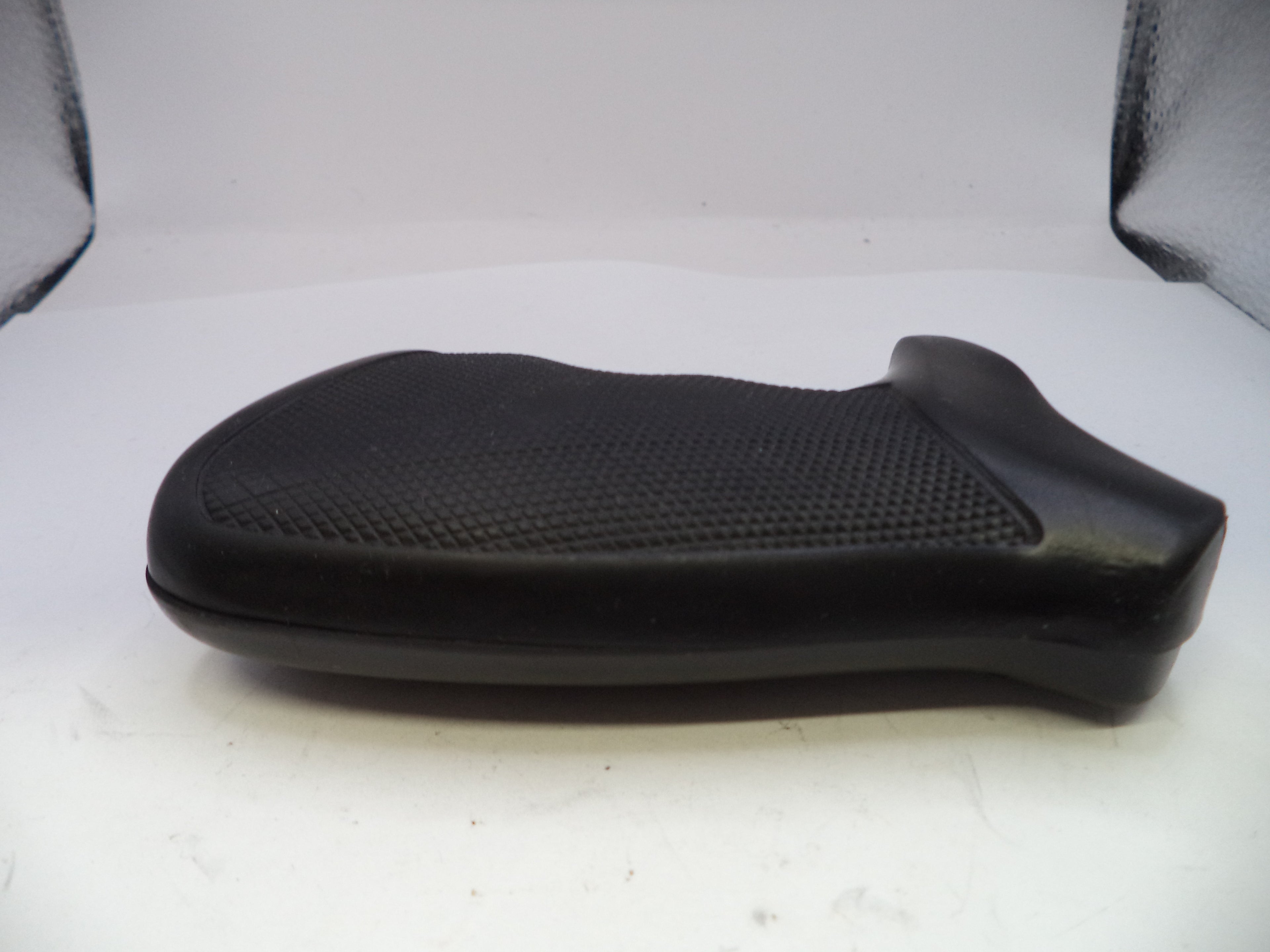 Black motorcycle seat on a white background