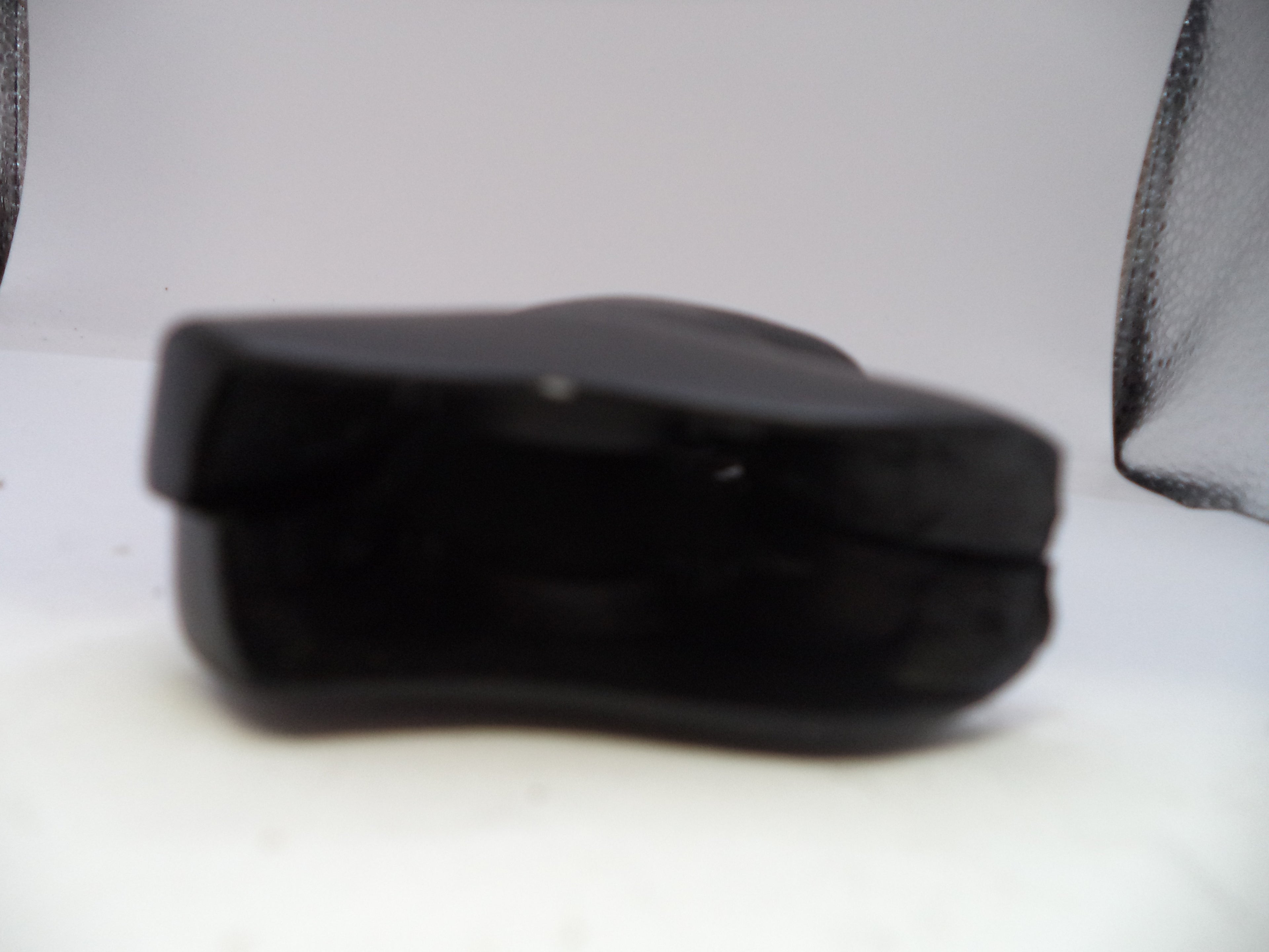 Black rectangular object on a white background