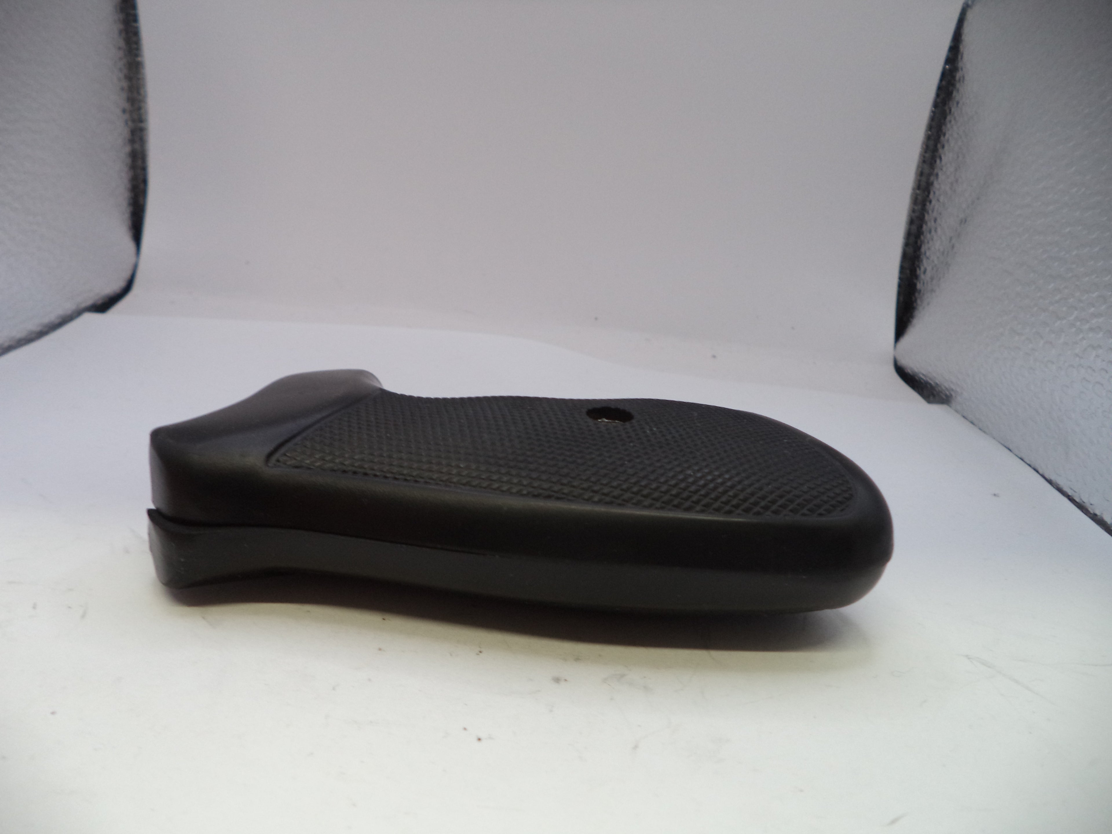 Black gun grip on a white background