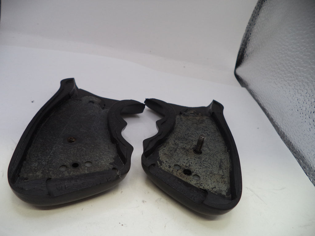 Two black rubber gaskets on a white surface