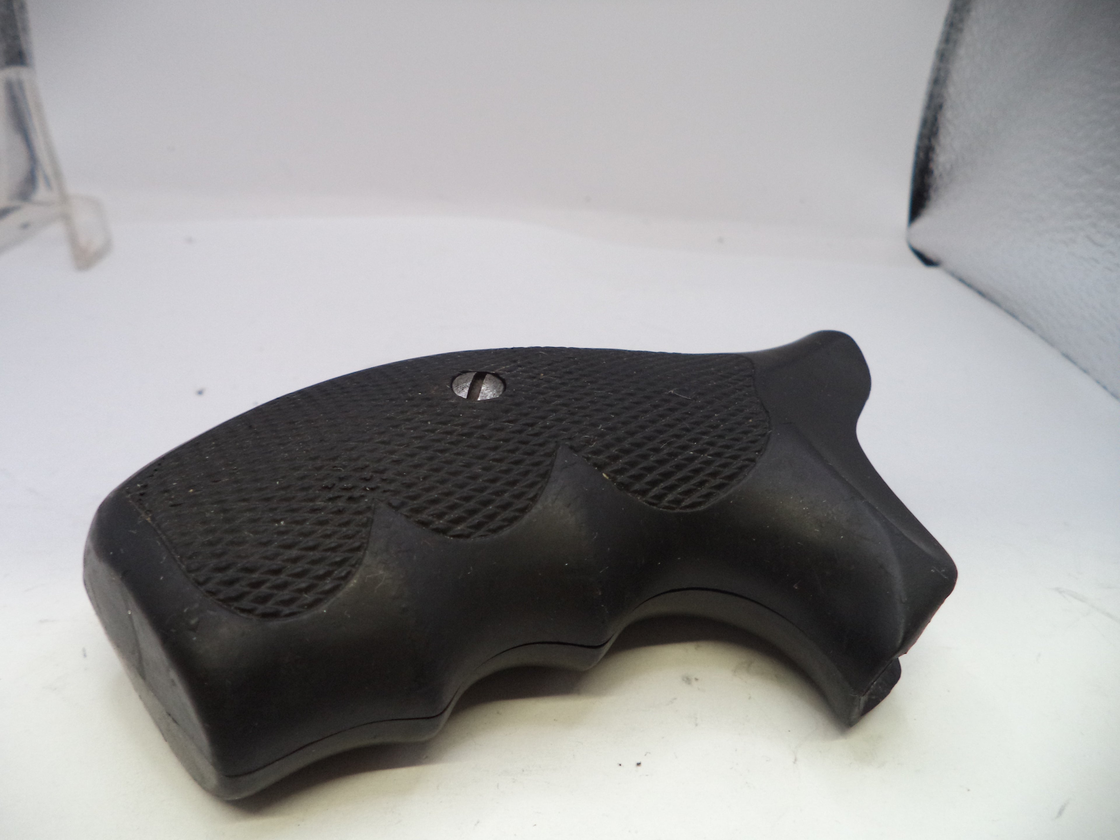 Black gun grip on a white background