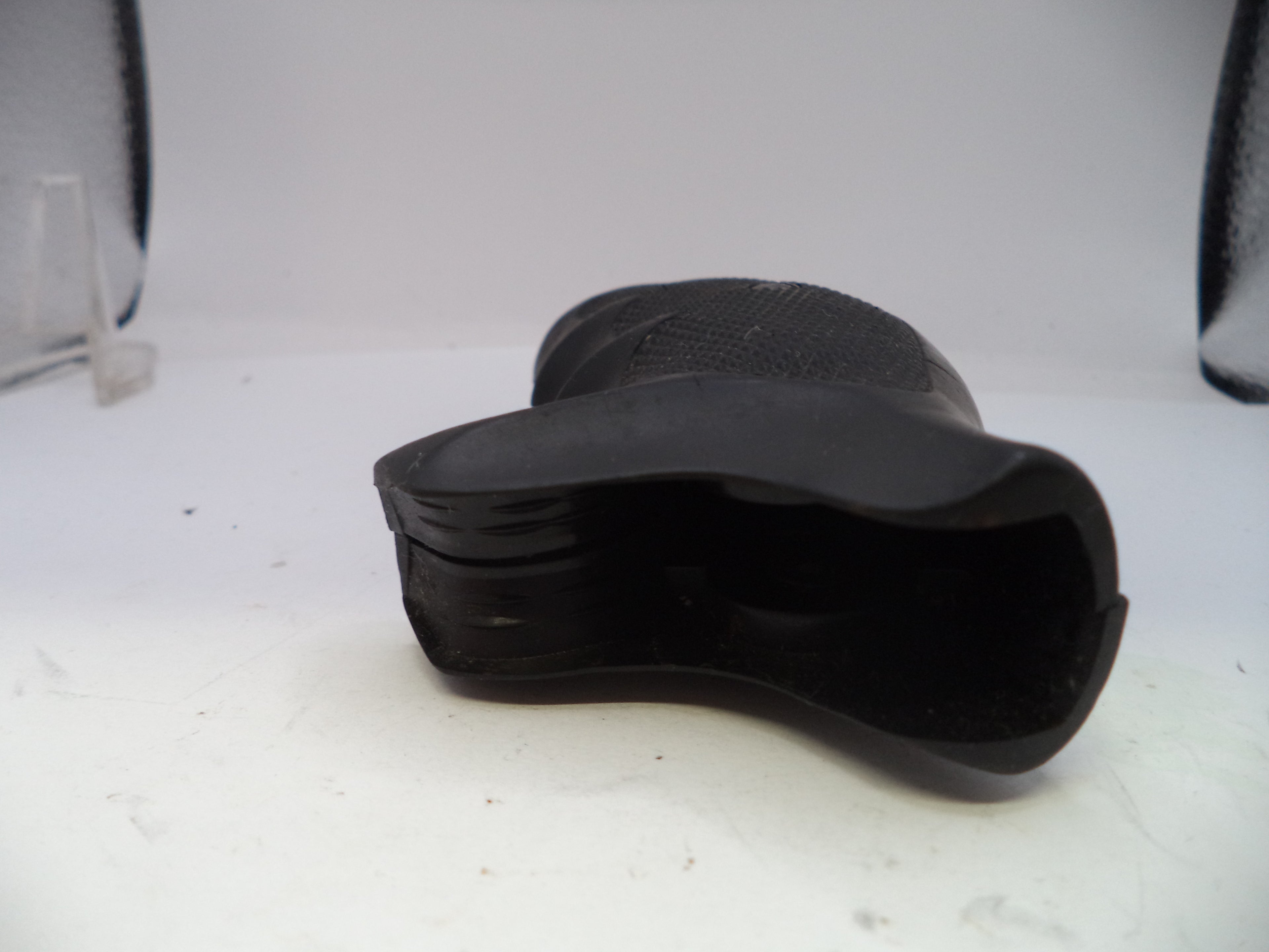 Close-up of a black shoe on a white background