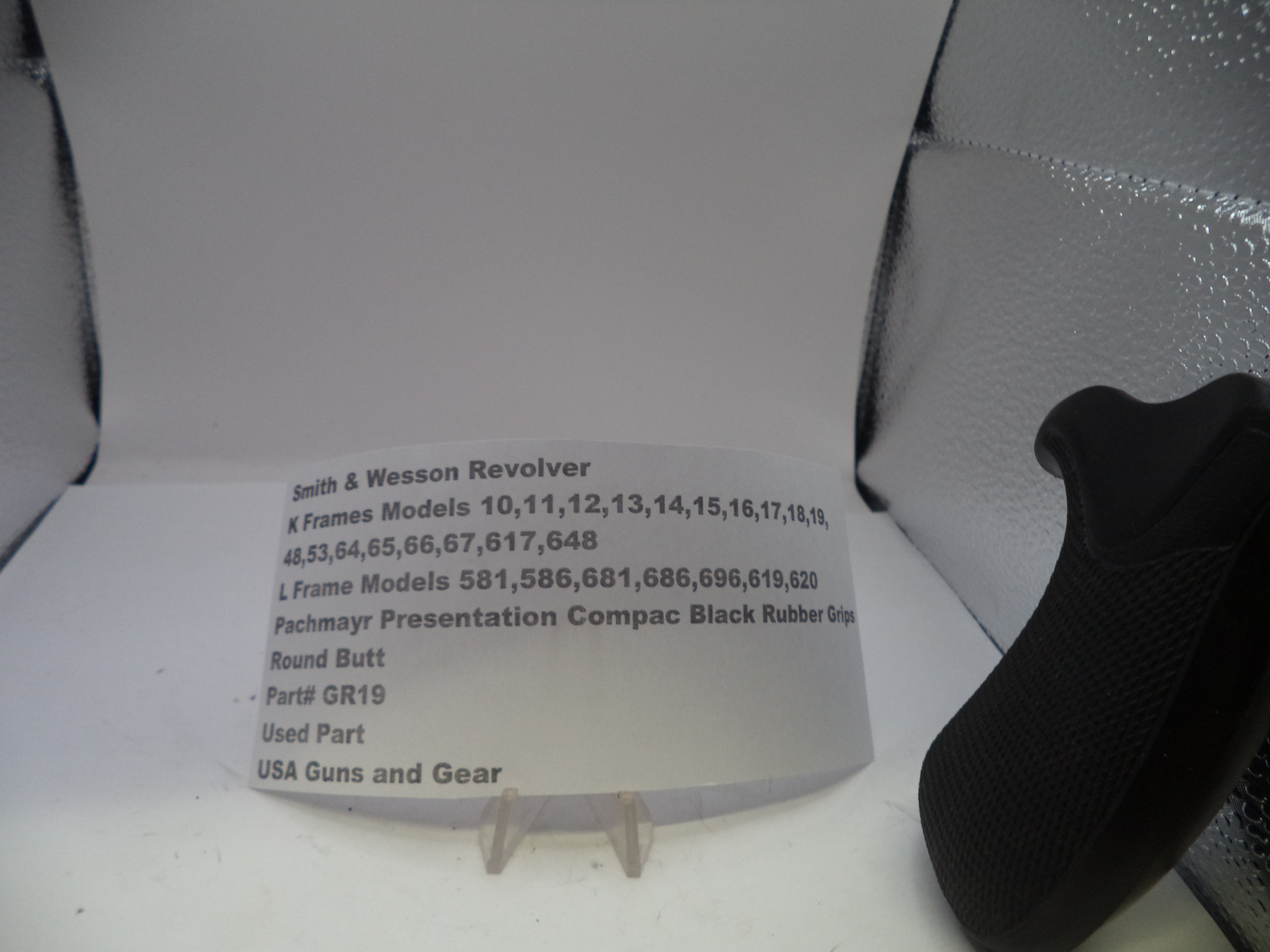 Black rubber butt on a white card with text in a gray box