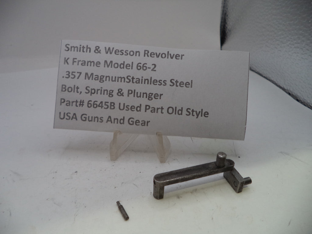 Smith & Wesson revolver part with descriptive card on a white background