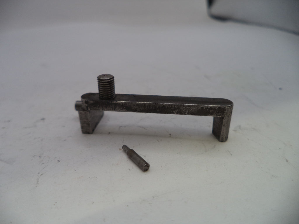 Metal tool or component on a white surface