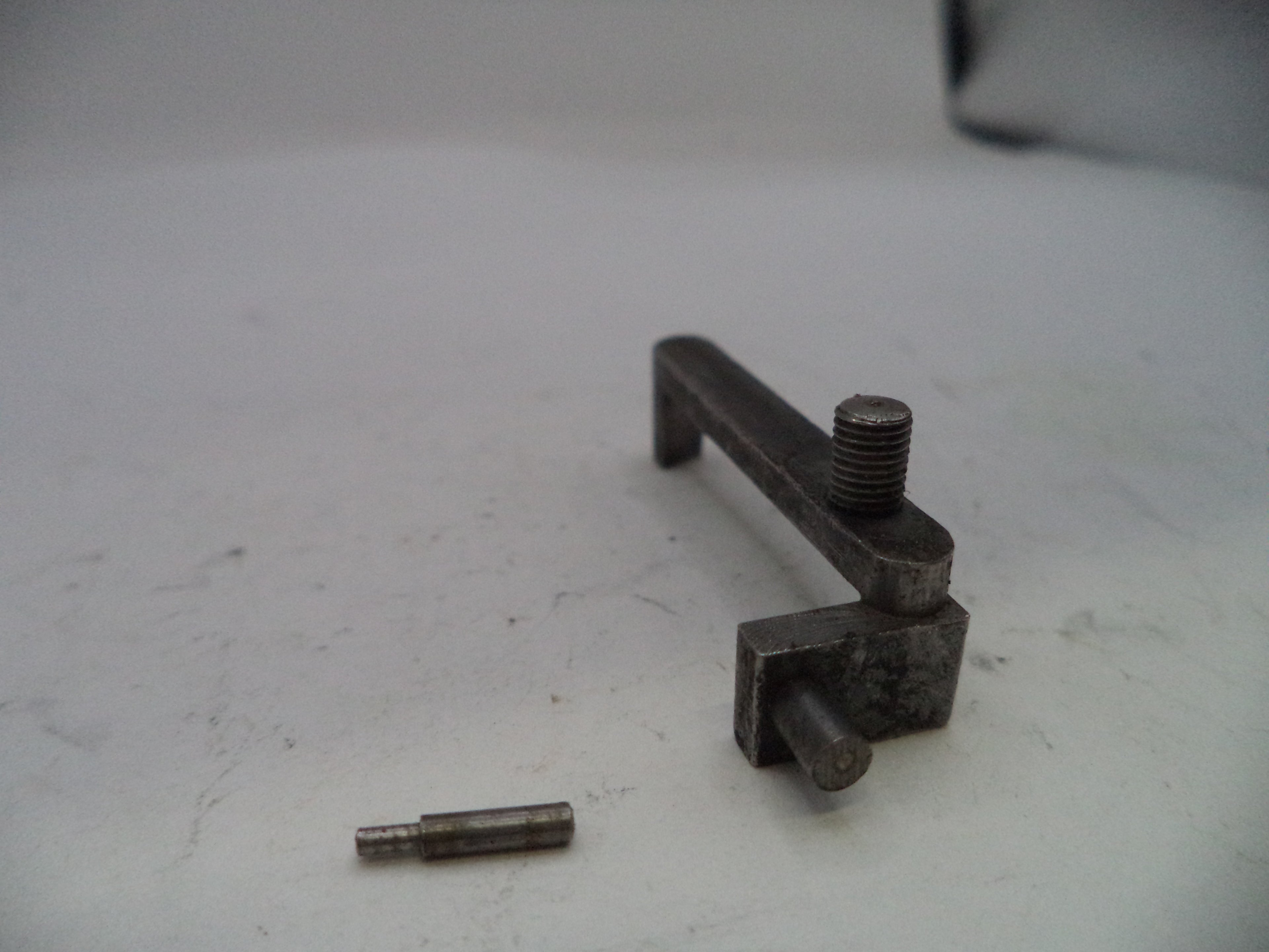 Metal mechanical component on a white surface