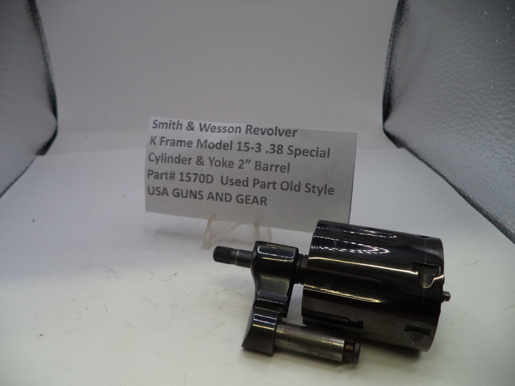 Smith & Wesson revolver part on a white background with a label