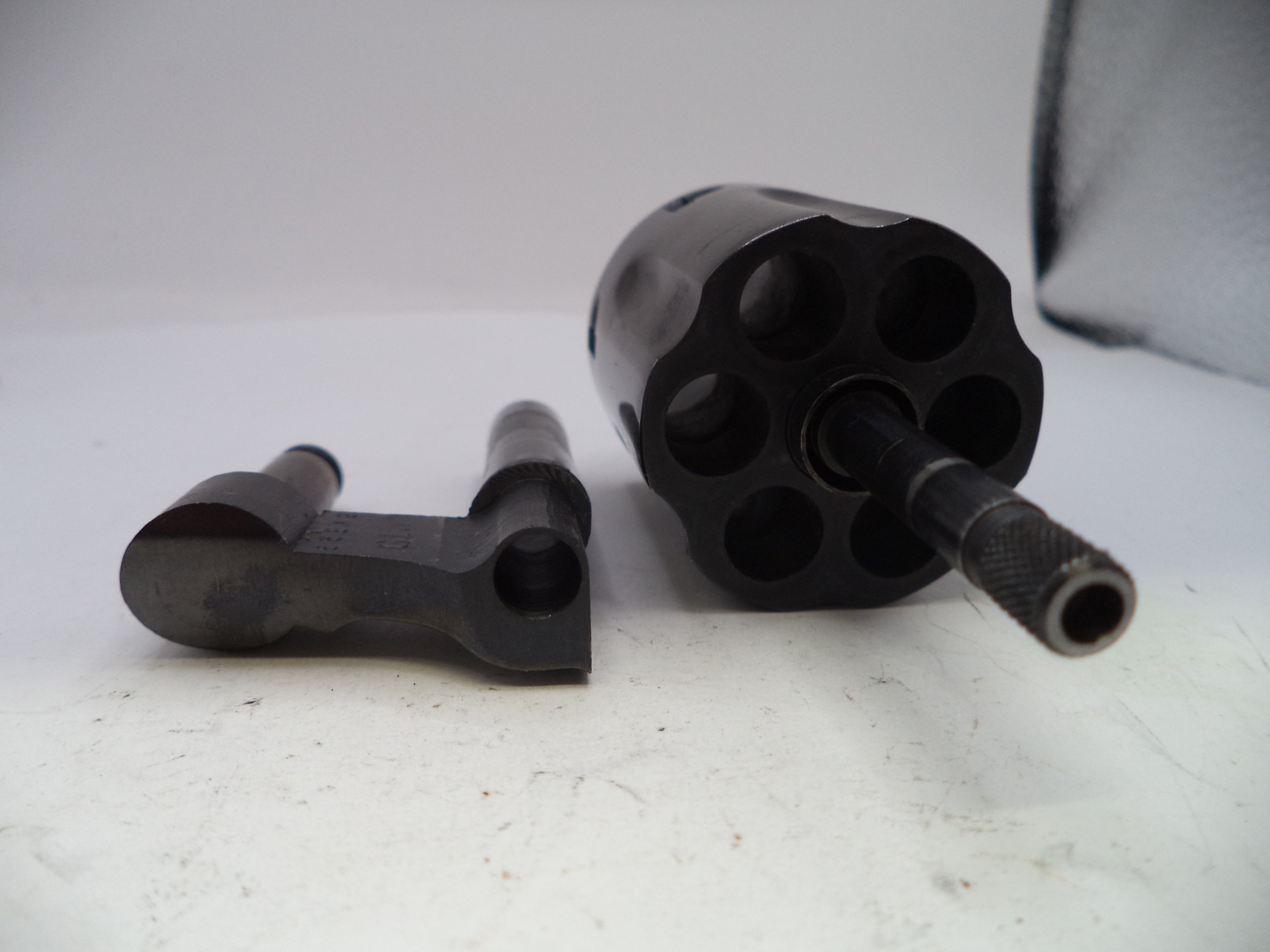 Black metal components on a white surface