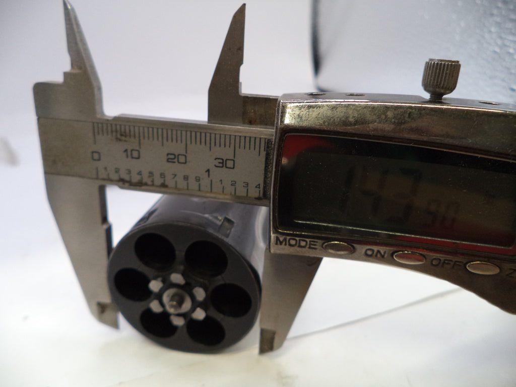 Caliper measuring a cylindrical object with a digital display