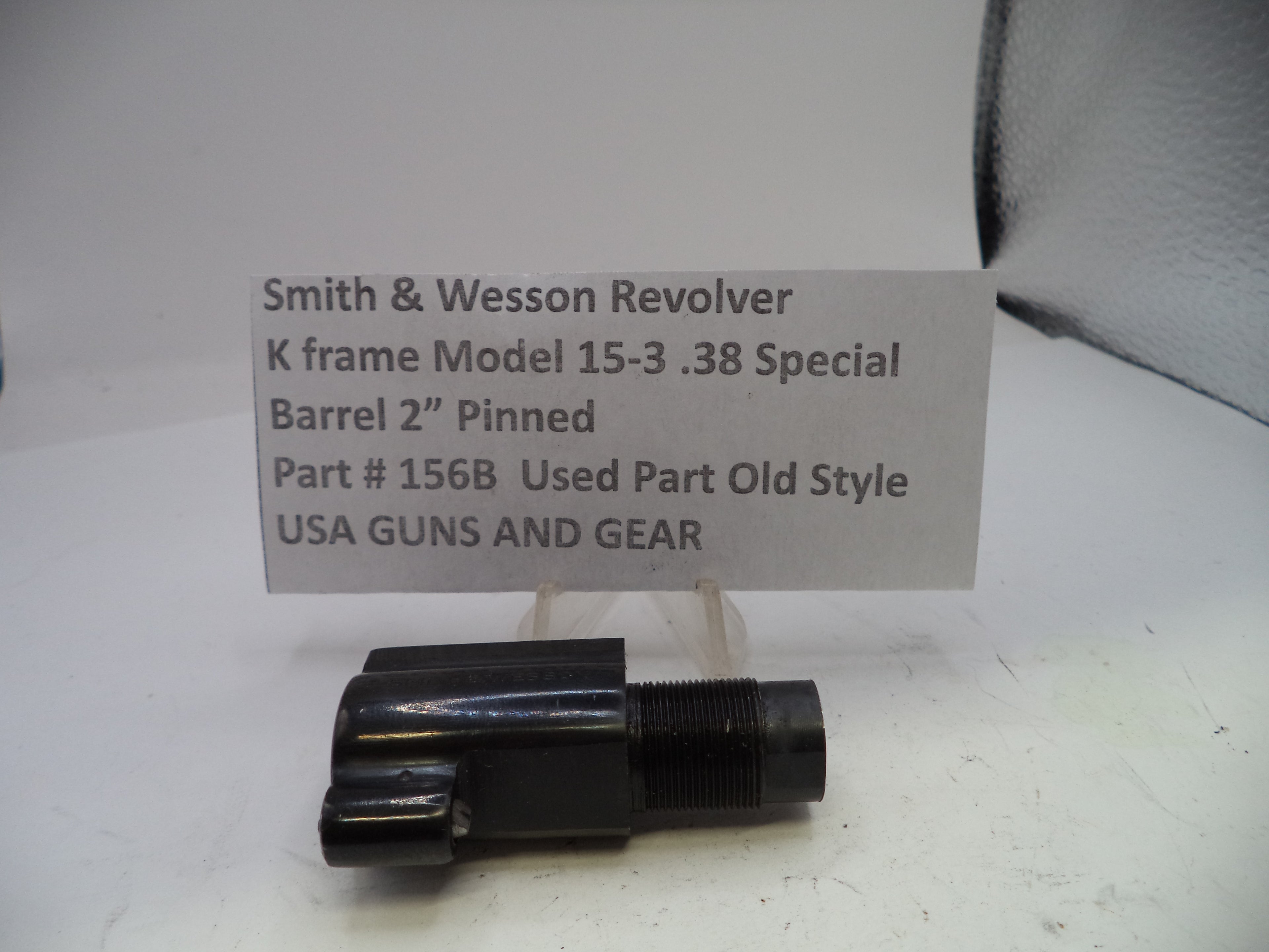 Smith & Wesson revolver barrel on a white background with a label.