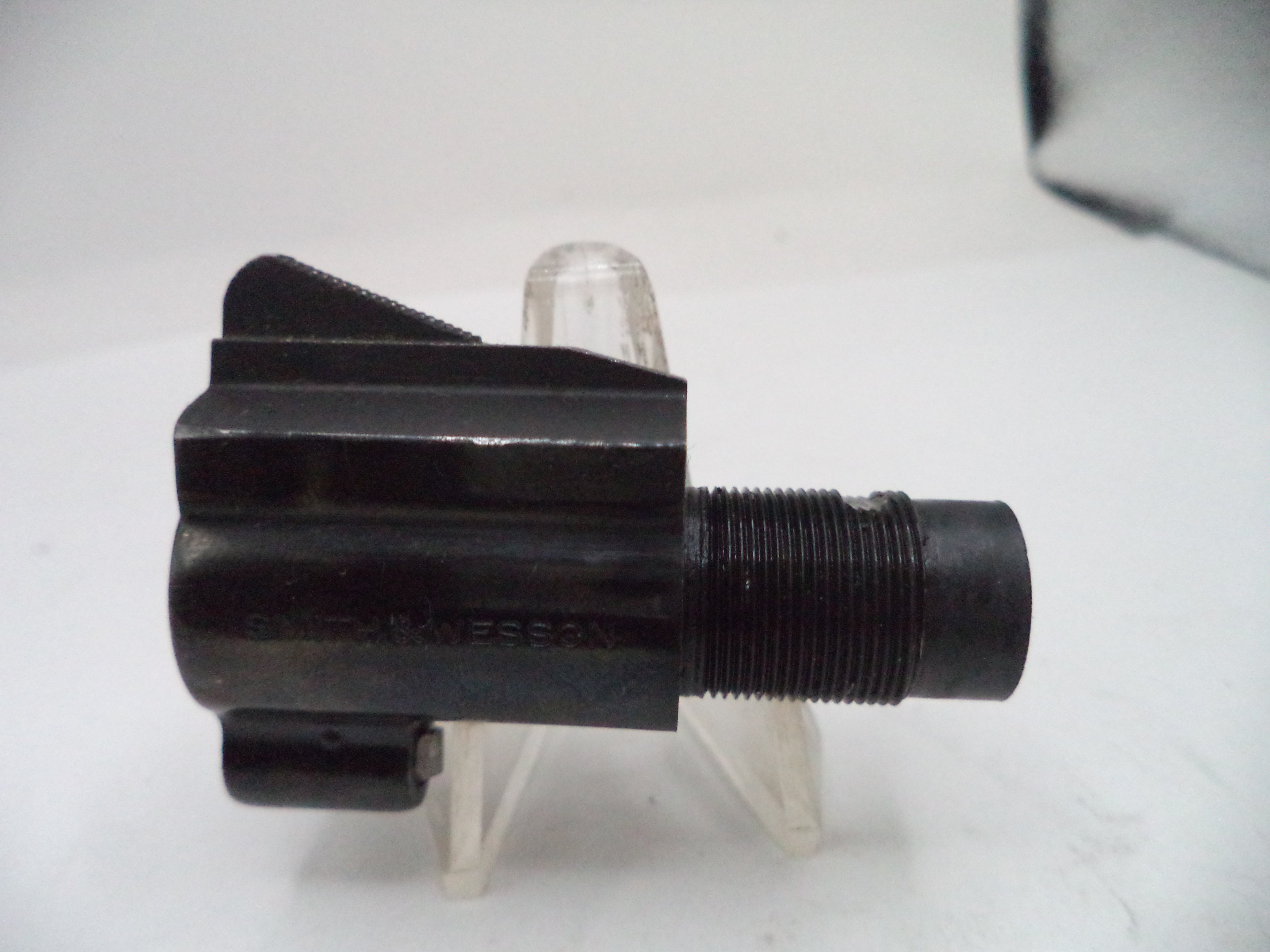 Black mechanical component on a white background
