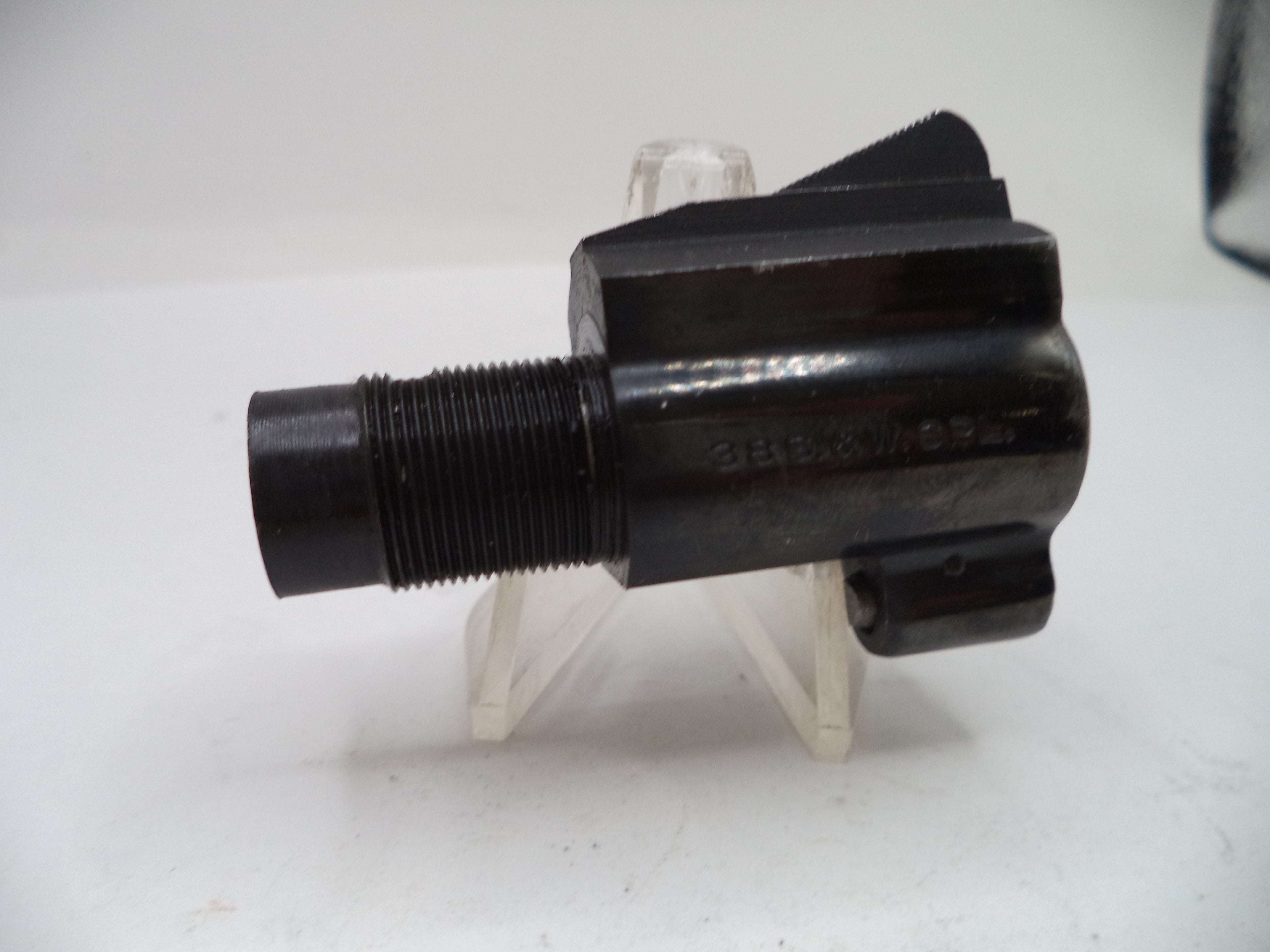 Black mechanical component on a white background