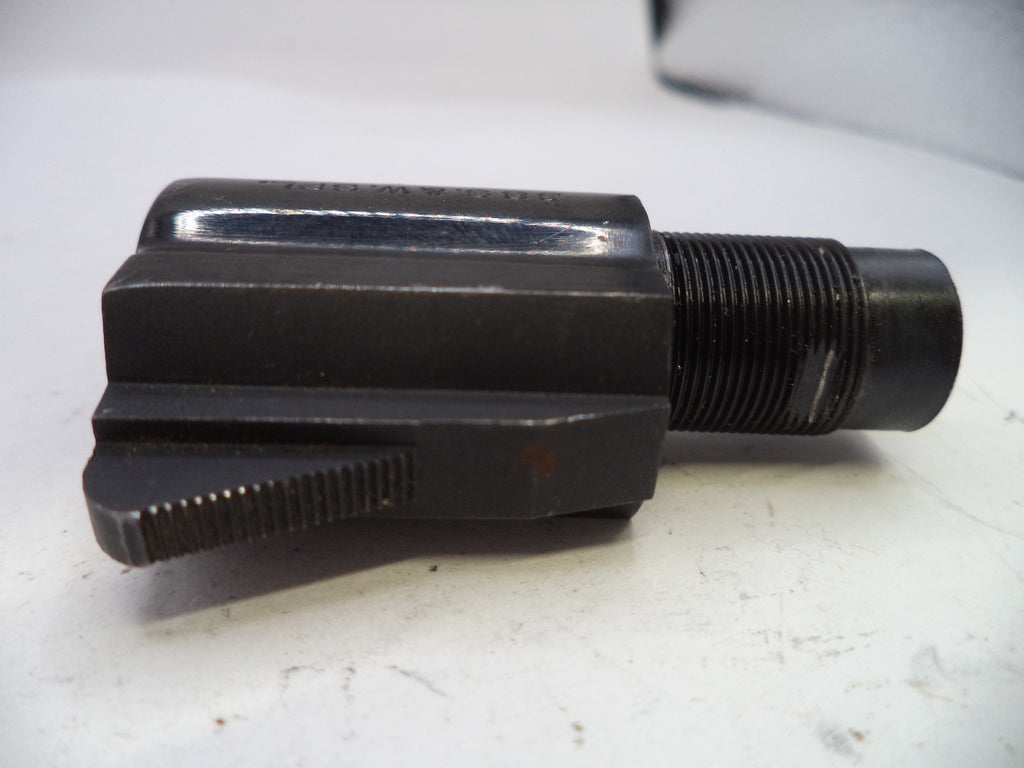 Black metal tool or component on a white surface
