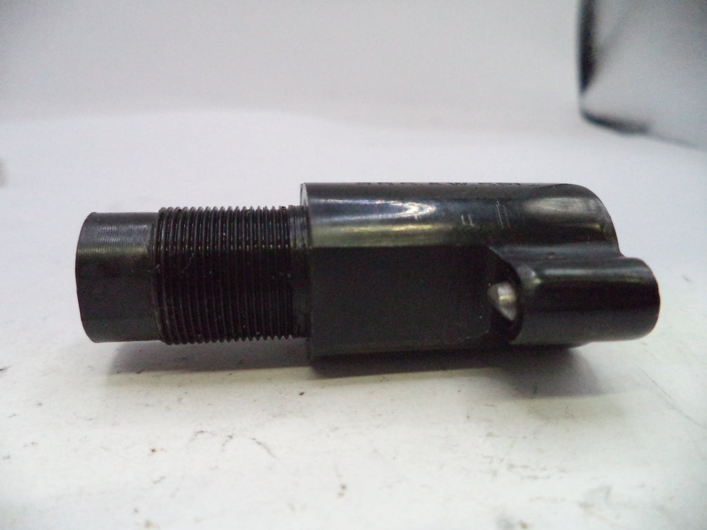 Black mechanical component on a white surface