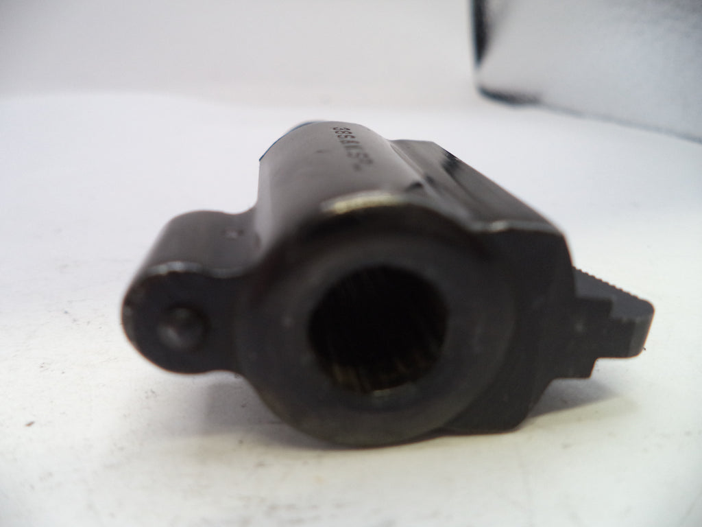 Black mechanical component on a white background