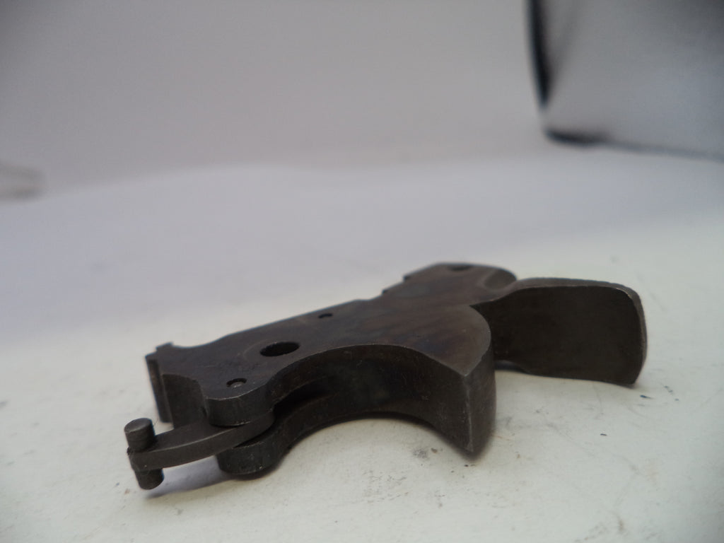 Black metal component on a white surface