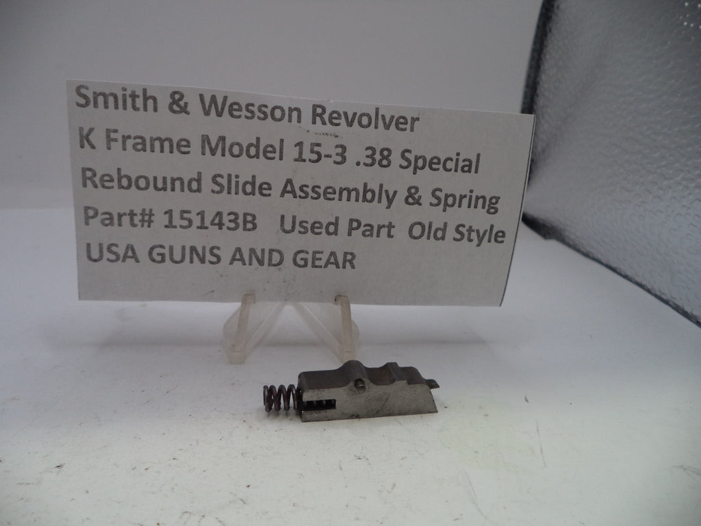 Smith & Wesson revolver slide assembly and spring on a white background with a label.