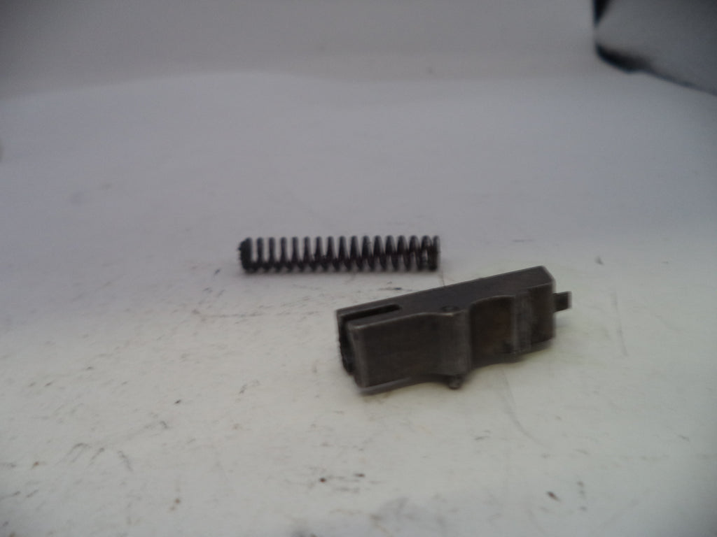 Two black plastic components on a white surface