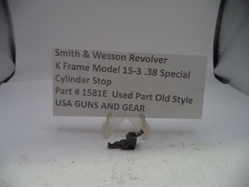 Smith & Wesson revolver cylinder stop with a descriptive card on a white background