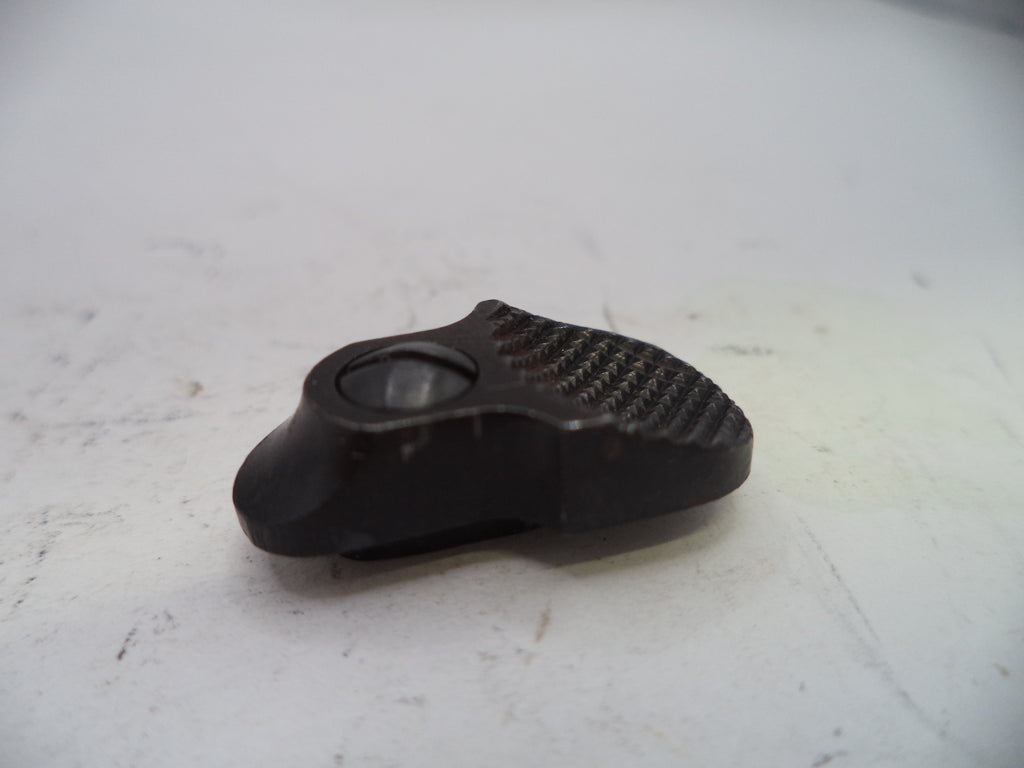 Black plastic component on a white surface