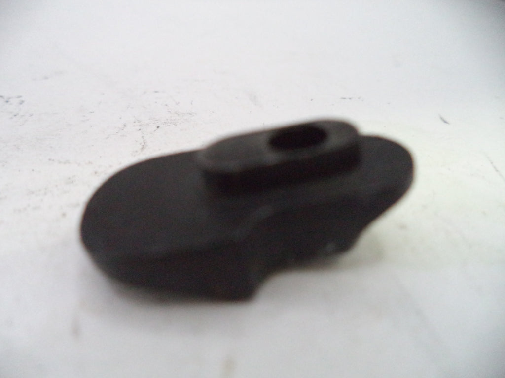 Black plastic component on a white background