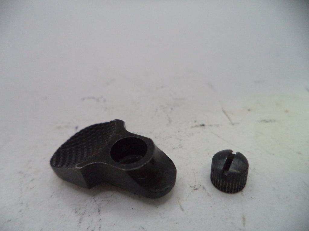 Two black mechanical parts on a white surface