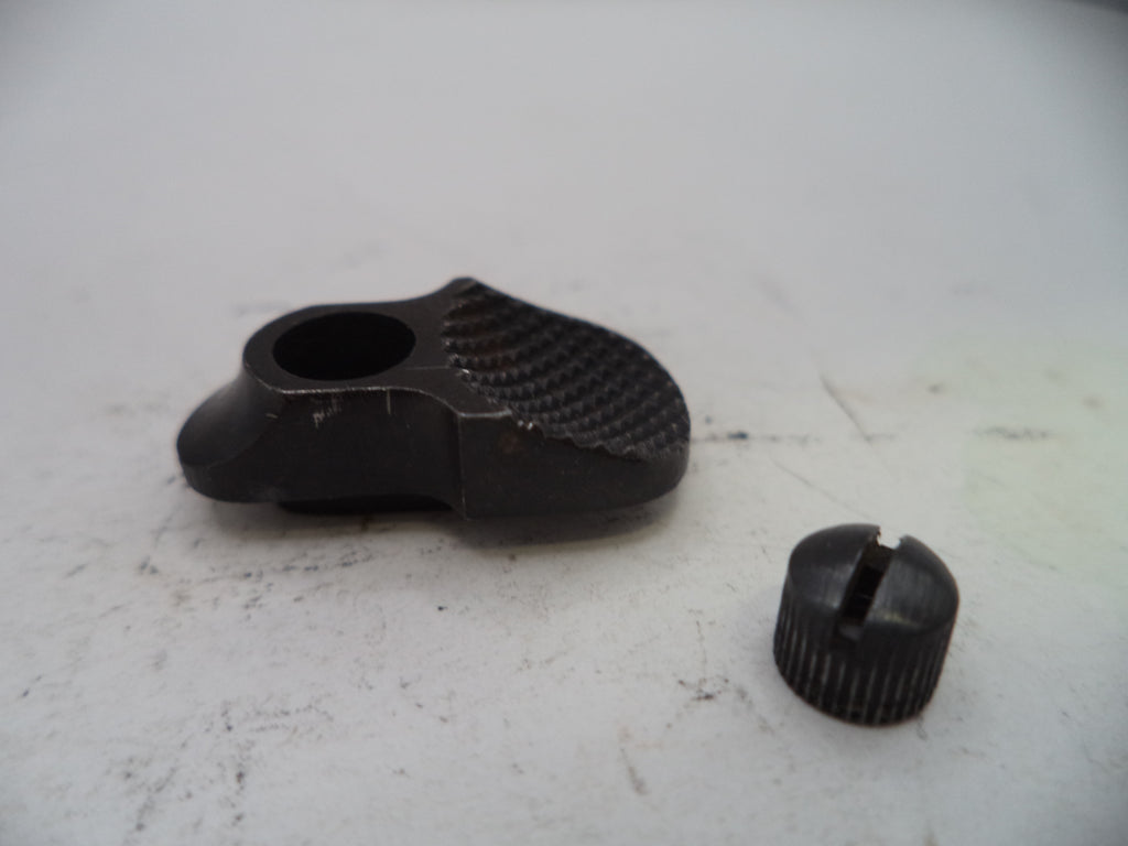Two black metal components on a white surface