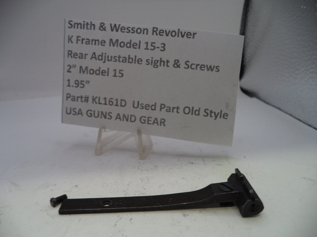 Smith & Wesson revolver sight and screws on a white background with a label.