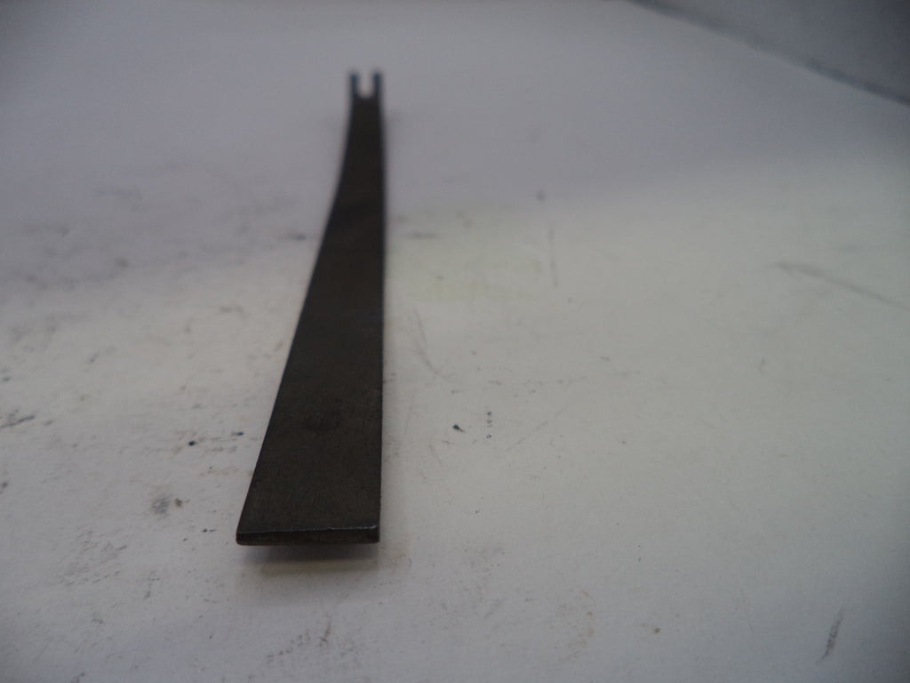 Metal tool on a white surface