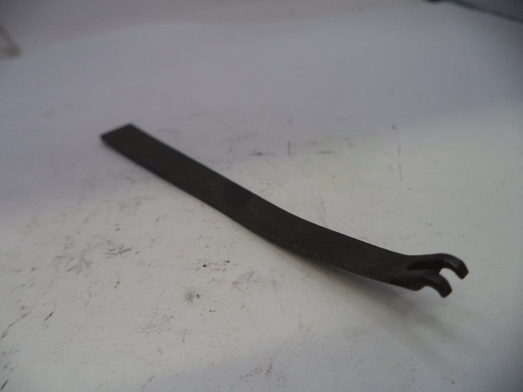 Metal tool on a white surface