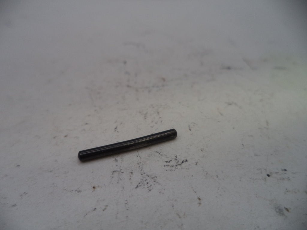 Black cylindrical object on a white surface