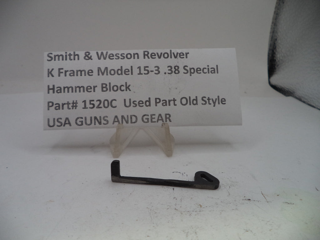 Smith & Wesson revolver hammer block part on a white background with a label.