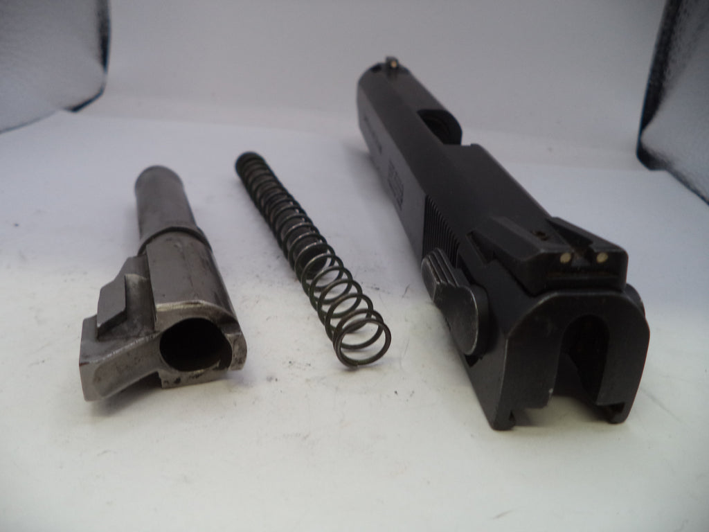 Disassembled gun components on a white background