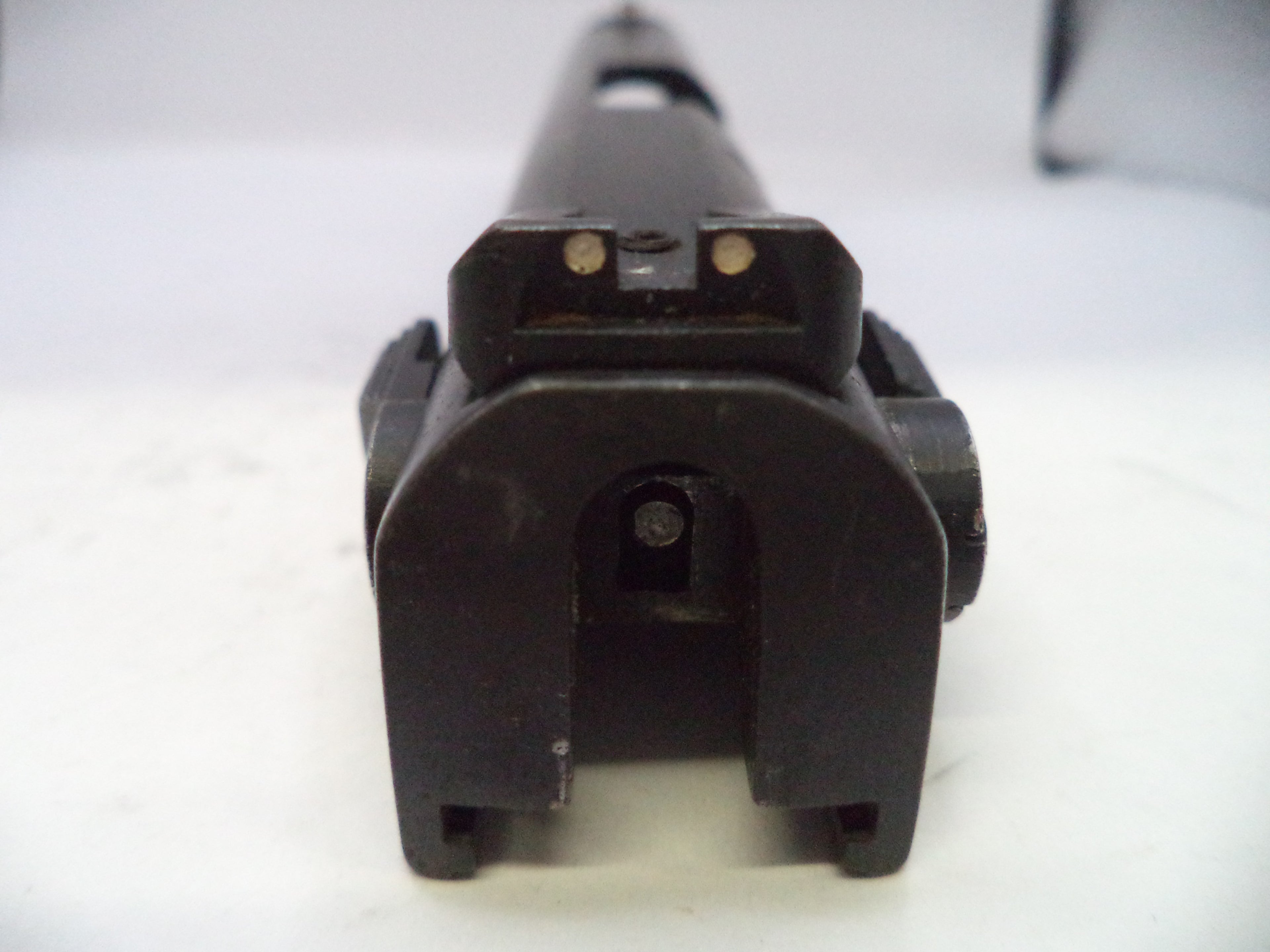 Close-up of a black mechanical component on a white background