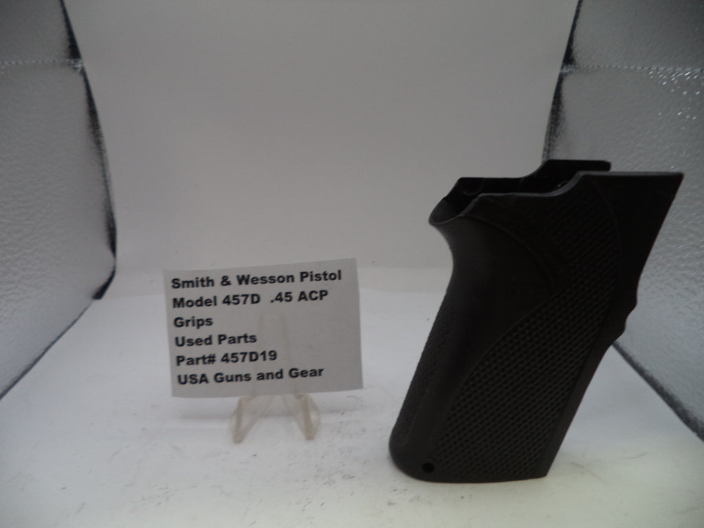 Black gun grip with a label on a white background